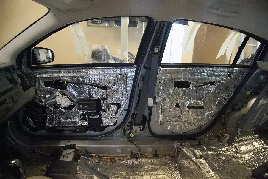 Sound deadening material applied to a car's interior metal panel