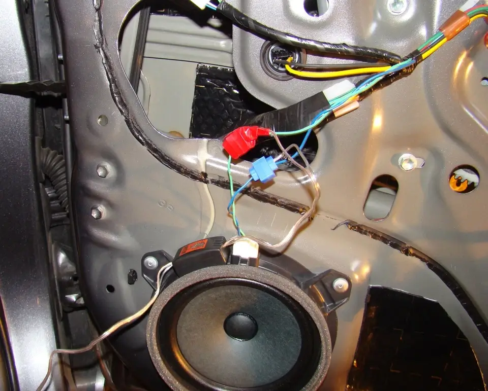 Technician carefully soldering a wire connection