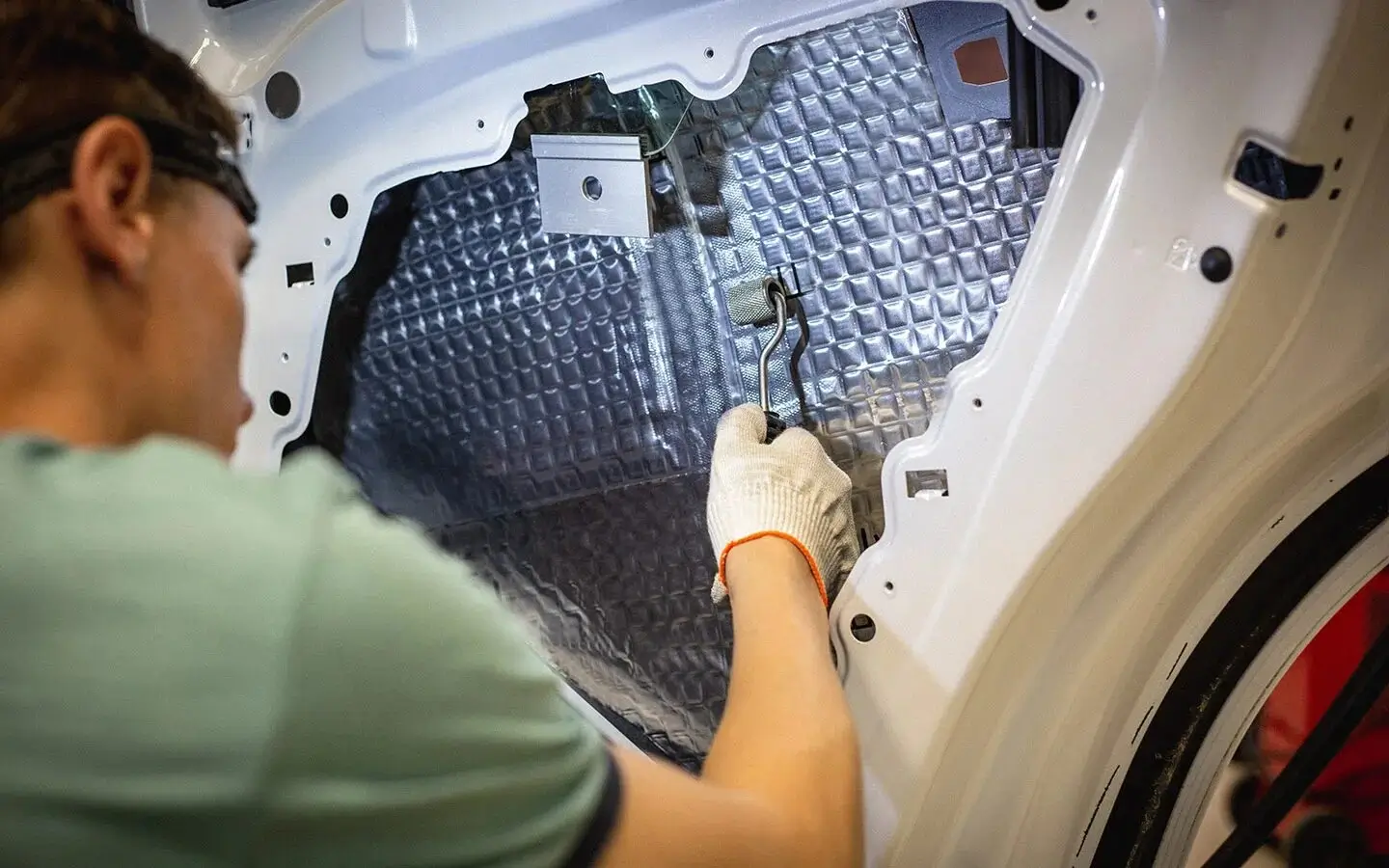 A car door with sound deadening material applied